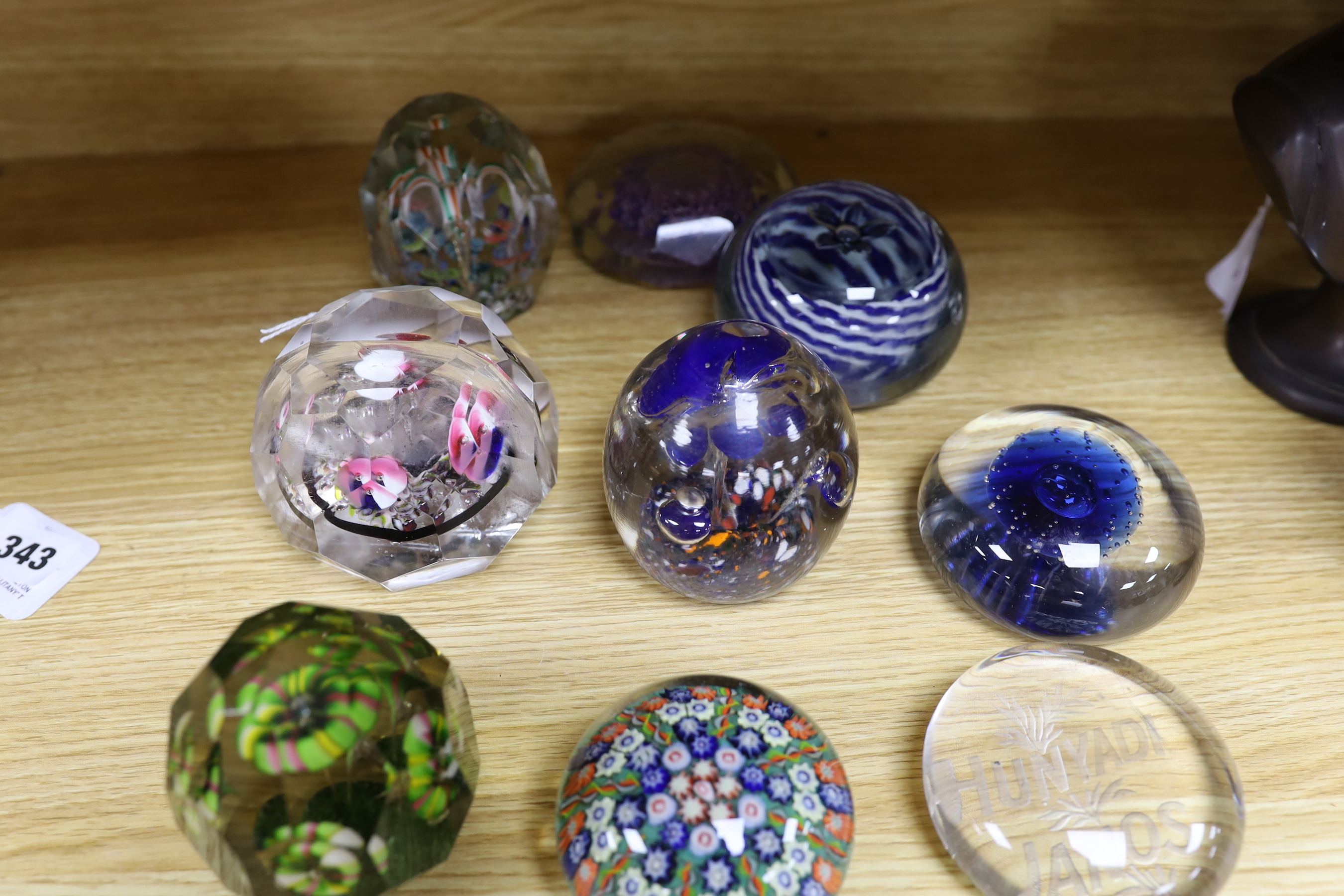Nine various Bohemian or Hungarian glass paperweights, including for early 20th century Bohemian faceted glass paperweights